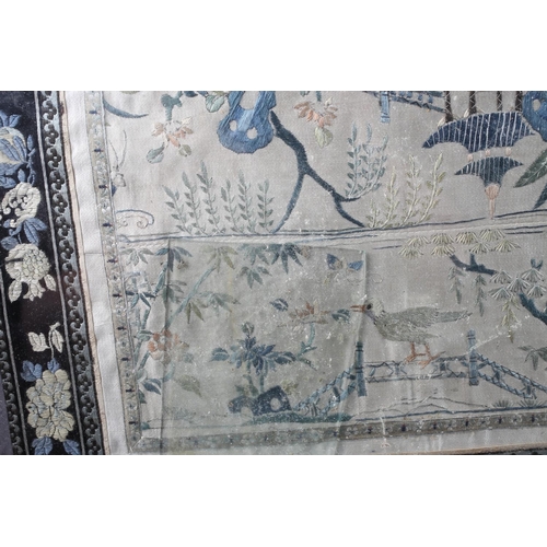 119 - A Chinese silk embroidery with garden, bird and floral designs, 25