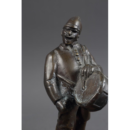 159 - Bokos: a patinated bronze figure of a drummer, on pink marble base, 10