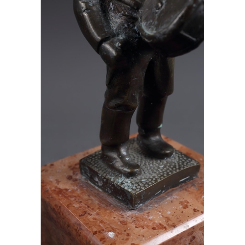 159 - Bokos: a patinated bronze figure of a drummer, on pink marble base, 10