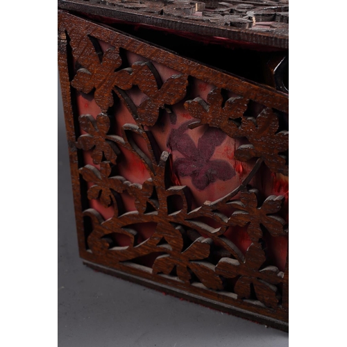 166 - A late 19th century oak fretwork slope top box, 11