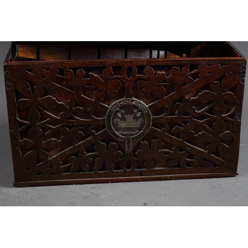 166 - A late 19th century oak fretwork slope top box, 11