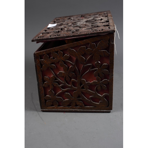 166 - A late 19th century oak fretwork slope top box, 11