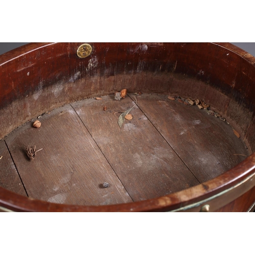 170 - An oak and brass coopered oval-shaped wine cooler/jardiniere, on four scrolled supports