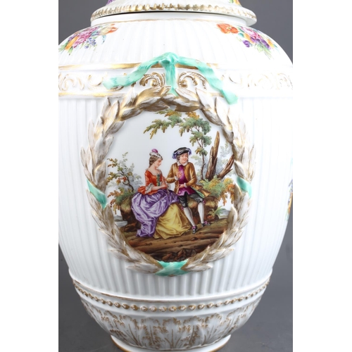 3 - A pair of 19th century Berlin porcelain oviform reeded jars and covers with eagle surmounts and rese... 