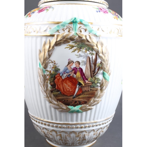 3 - A pair of 19th century Berlin porcelain oviform reeded jars and covers with eagle surmounts and rese... 