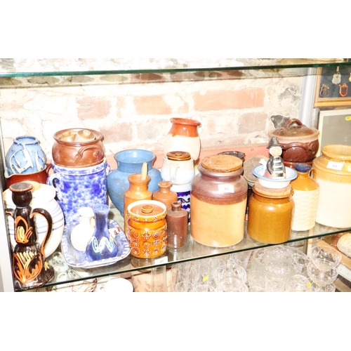 68 - A quantity of studio pottery, including storage jars, vases, candlesticks and other items