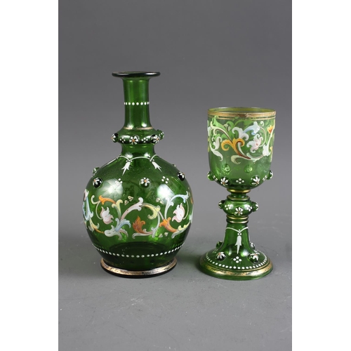 84 - A Continental green glass decanter with enamelled decoration (no stopper), a matching glass, two dec... 