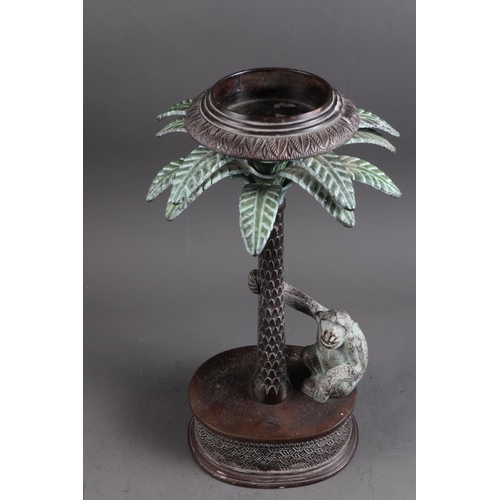 197 - A South African cast brass and patinated stand with palm tree and ape, 17