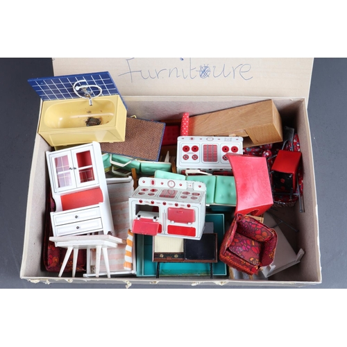 202 - A doll's house, furniture and a quantity of dolls and toy monkeys, various