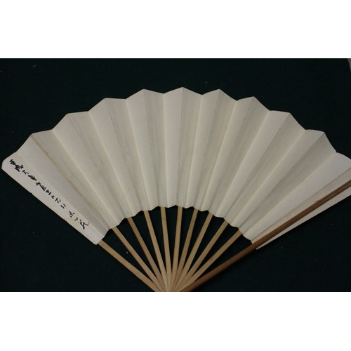 112 - Fifteen Japanese fans, some with calligraphy decoration, various