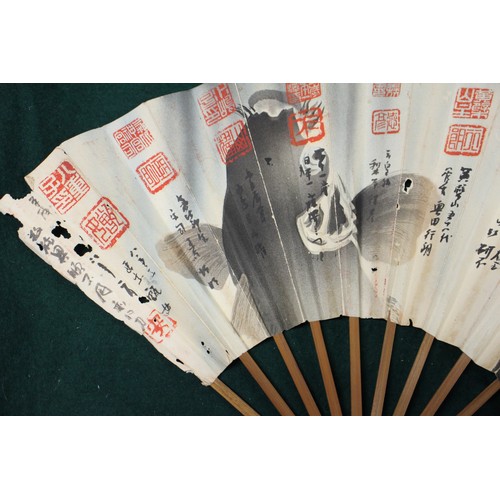 112 - Fifteen Japanese fans, some with calligraphy decoration, various