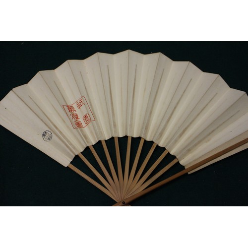 112 - Fifteen Japanese fans, some with calligraphy decoration, various