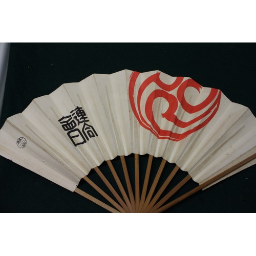 112 - Fifteen Japanese fans, some with calligraphy decoration, various