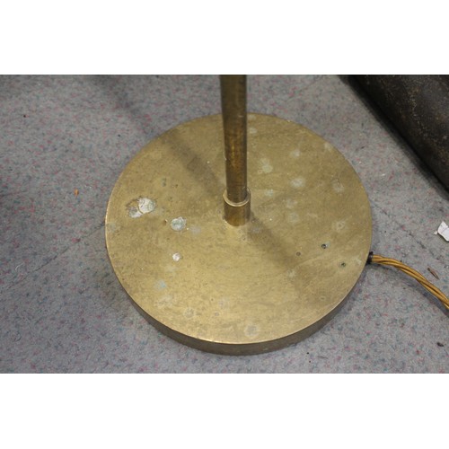 229 - A pair of brass adjustable floor standing reading lights, on circular bases, 45