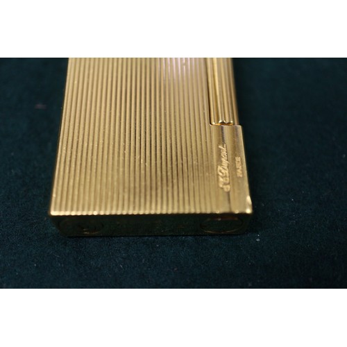 331 - An ST Dupont gilt cased Gatsby lighter, in original case, boxed