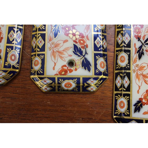 74 - Two pairs of Imari pattern door plates, two similar key plates, two similar handles, other various h... 