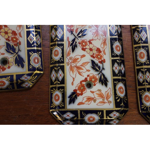 74 - Two pairs of Imari pattern door plates, two similar key plates, two similar handles, other various h... 