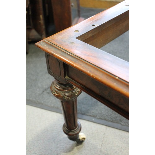 448 - A 19th century walnut low stool, on carved and turned castored supports, 38