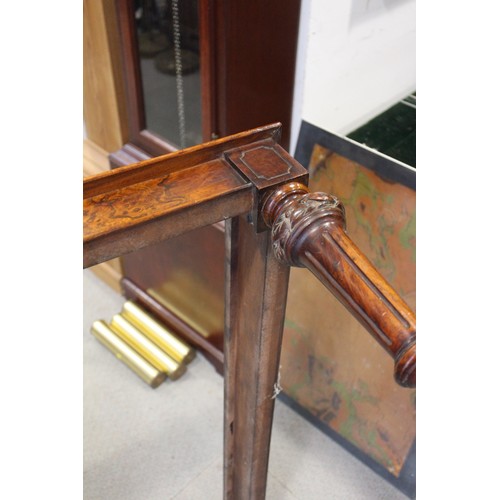 448 - A 19th century walnut low stool, on carved and turned castored supports, 38