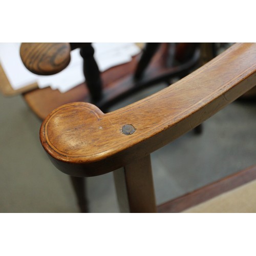 483 - An Edwardian walnut and line inlaid elbow chair with drop-in seat, on square taper supports