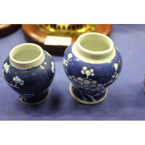 103 - Two Chinese blue and white tea bowls with panelled floral decoration and four-character, double ring... 