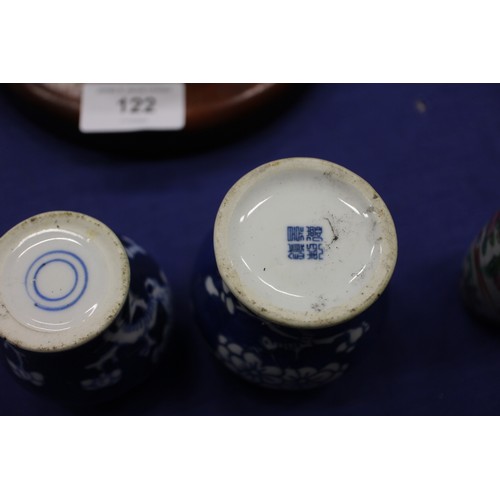 103 - Two Chinese blue and white tea bowls with panelled floral decoration and four-character, double ring... 