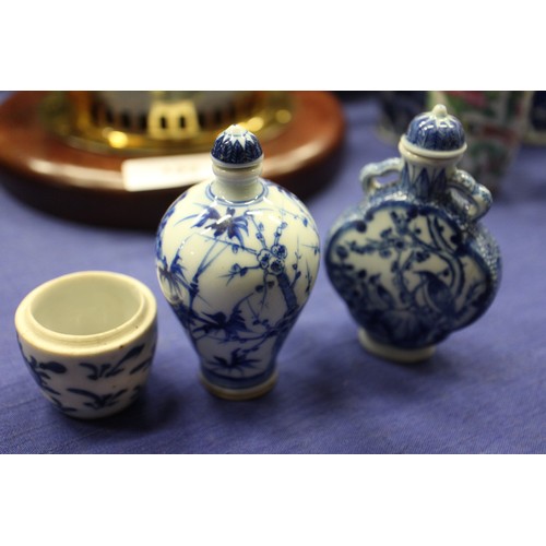 103 - Two Chinese blue and white tea bowls with panelled floral decoration and four-character, double ring... 