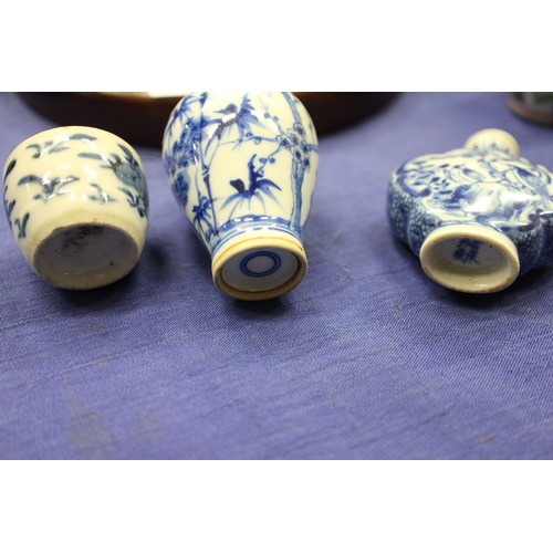 103 - Two Chinese blue and white tea bowls with panelled floral decoration and four-character, double ring... 