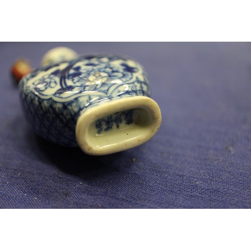 103 - Two Chinese blue and white tea bowls with panelled floral decoration and four-character, double ring... 