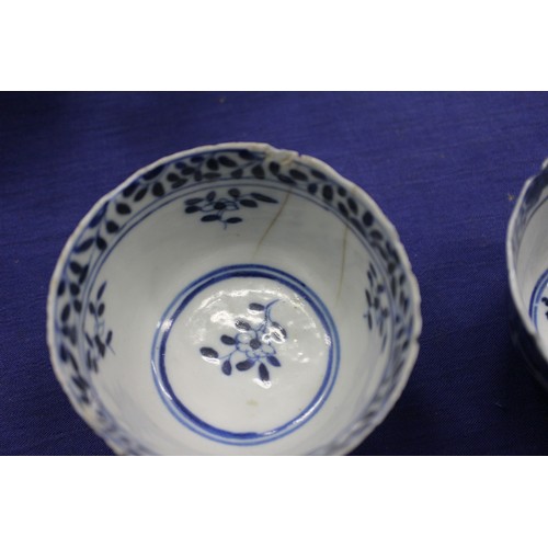 103 - Two Chinese blue and white tea bowls with panelled floral decoration and four-character, double ring... 