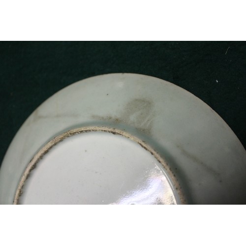 92 - A Chinese celadon glazed plate with insect and flower decoration, 7 1/4