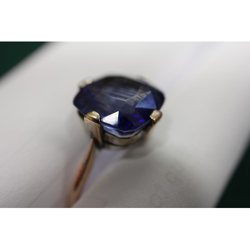 312 - A 9ct gold Ceylon sapphire solitaire ring, stone 10.4mm x 10.76mm x 6mm deep, size S