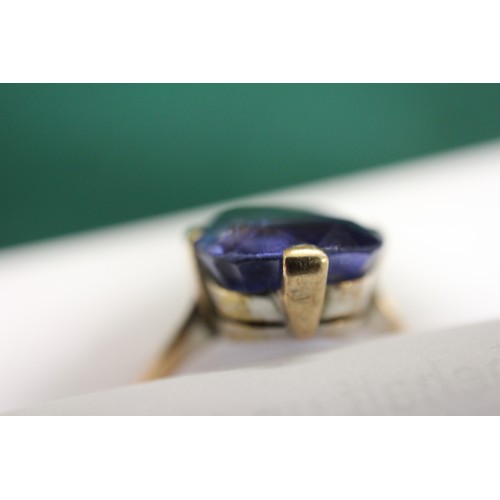 312 - A 9ct gold Ceylon sapphire solitaire ring, stone 10.4mm x 10.76mm x 6mm deep, size S