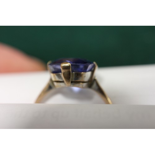 312 - A 9ct gold Ceylon sapphire solitaire ring, stone 10.4mm x 10.76mm x 6mm deep, size S