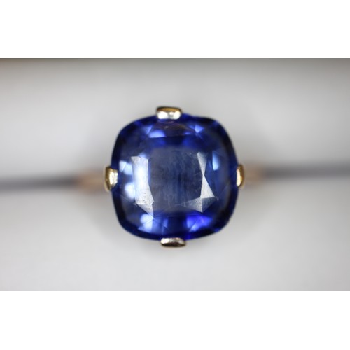 312 - A 9ct gold Ceylon sapphire solitaire ring, stone 10.4mm x 10.76mm x 6mm deep, size S