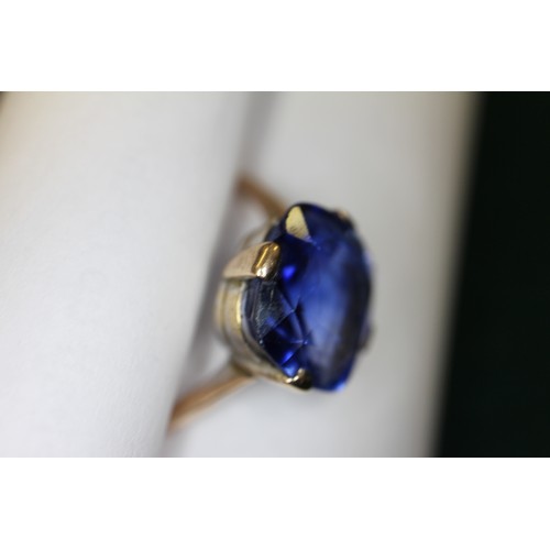 312 - A 9ct gold Ceylon sapphire solitaire ring, stone 10.4mm x 10.76mm x 6mm deep, size S