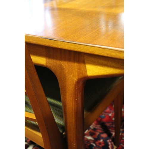 578 - An A H McIntosh & Co Ltd 1970s teak extending dining table with two extra integral leaves, 63