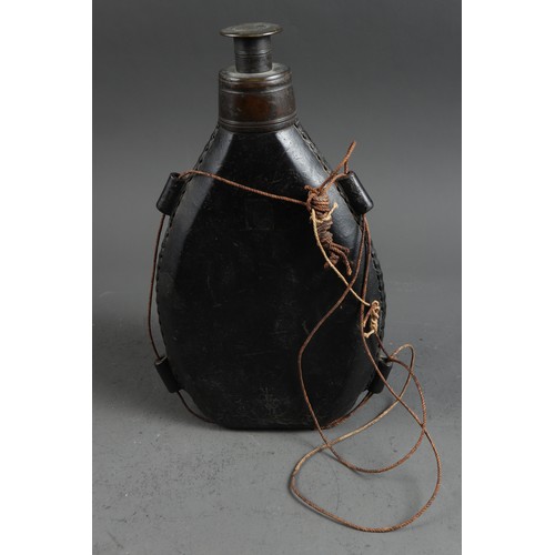 186 - A 17th century leather flask/bottle, 11