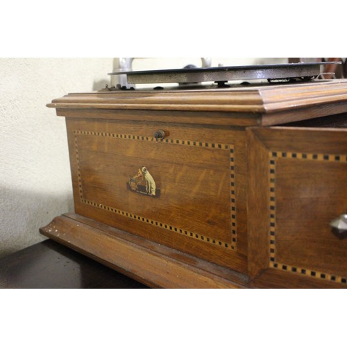 130 - An early 20th century oak cased record player