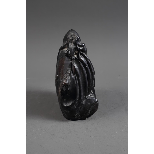 101 - A Chinese carved black hardstone figure, 6 1/4