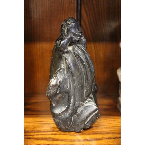 101 - A Chinese carved black hardstone figure, 6 1/4