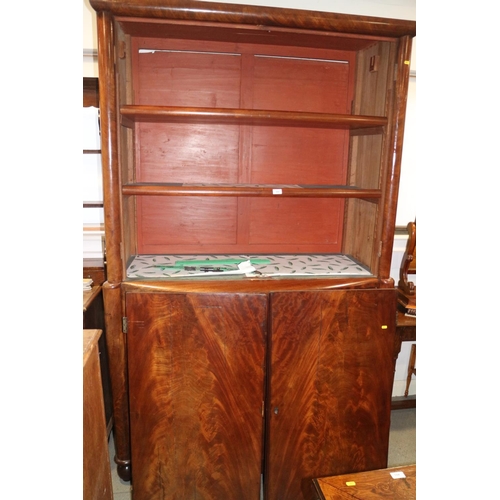 445 - A late 19th century Continental mahogany linen press, the upper section fitted adjustable shelves ov... 