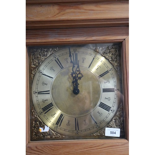 510 - A waxed pine long case clock with eight-day striking and chiming movement, and brass dial, 80