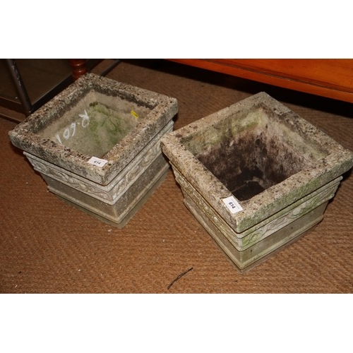 593 - A pair of cast stone square planters, 11