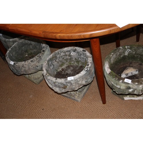 591 - A set of four cast stone planters with swag decoration, 15