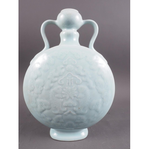 100 - A Chinese celadon glazed two-handled moon flask with pair of fish, character and cloud decoration, s... 