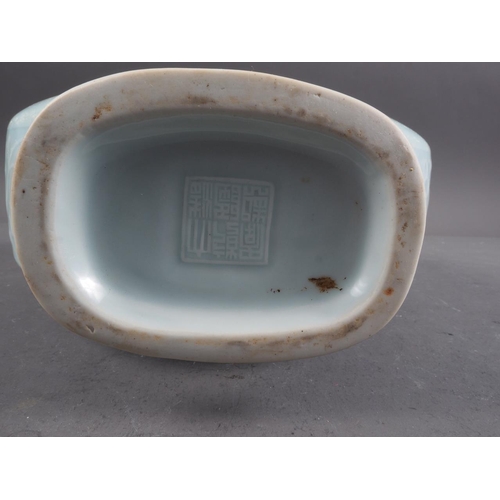 100 - A Chinese celadon glazed two-handled moon flask with pair of fish, character and cloud decoration, s... 