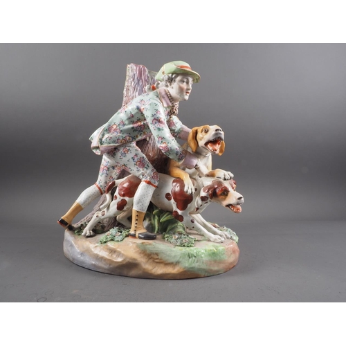 11 - A 19th century Meissen figure group of a hunter with two dogs by a tree, 14 1/2