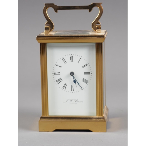 128 - A brass cased carriage clock by J W Benson with white enamel dial and Roman numerals, 5 3/4