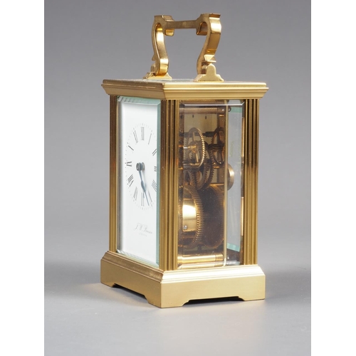 128 - A brass cased carriage clock by J W Benson with white enamel dial and Roman numerals, 5 3/4